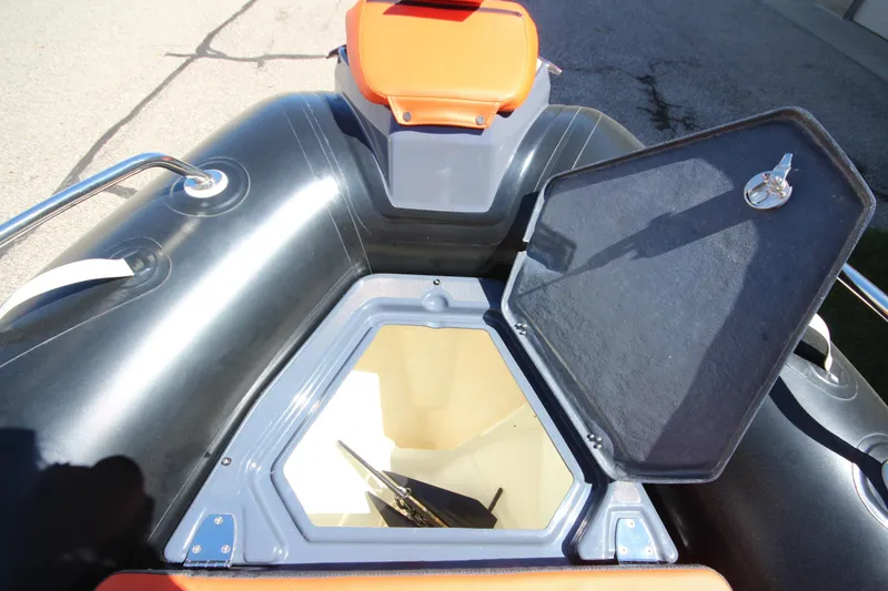 Slide: The Image of Open storage compartment on a 2021 Zodiac Medline 7.5 boat, showcasing interior space. - 25