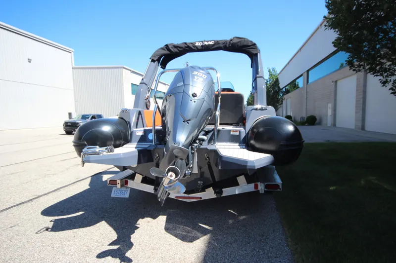 Slide: The Image of 2021 Zodiac Medline 7.5 boat with powerful outboard motor on trailer. - 7