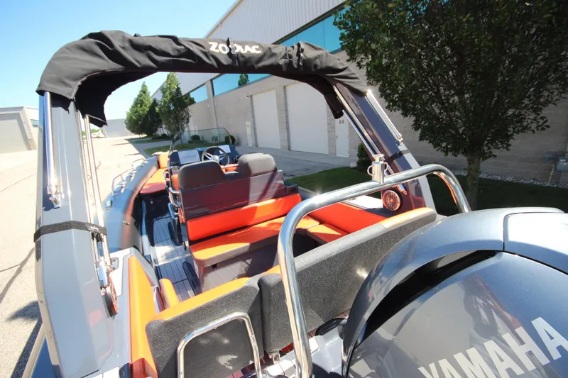 Slide: The Image of 2021 Zodiac Medline 7.5 boat with Yamaha engine, docked outdoors. - 9