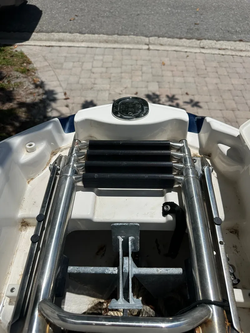Slide: The Image of A swim ladder on a boat, surrounded by a paved area. - 17