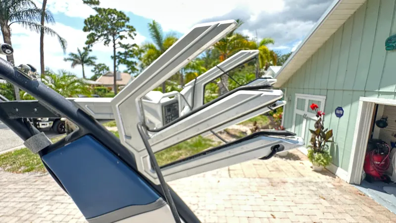 Slide: The Image of Close-up of a boat detail with palm trees in the background. - 35