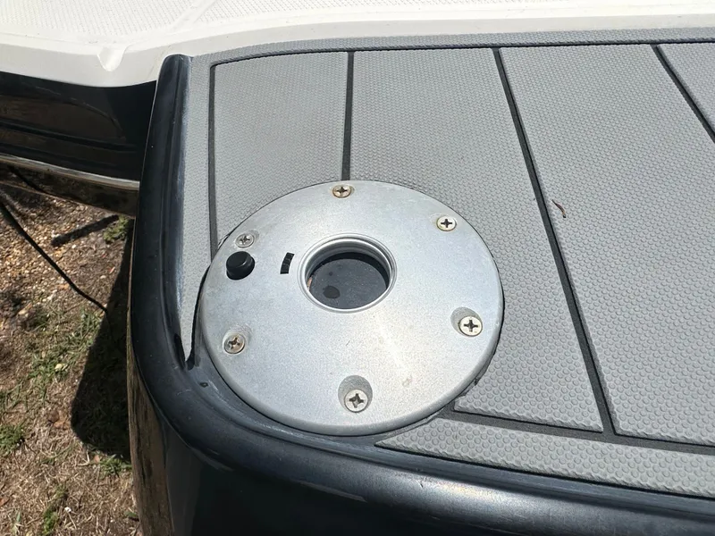 Slide: The Image of Close-up of a boat deck with a round metal fitting. - 48