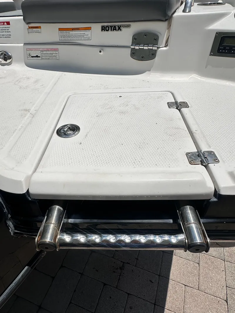 Slide: The Image of Stern platform of a 2017 Chaparral 243VRX with a retractable swim ladder. - 49