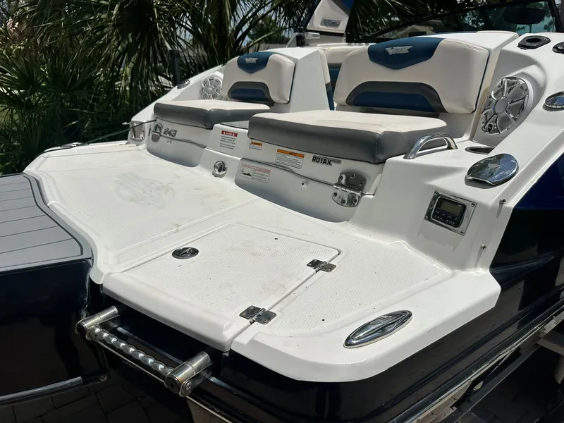 Slide: The Image of Rear view of a Chaparral 243VRX boat with seating and speakers. - 5