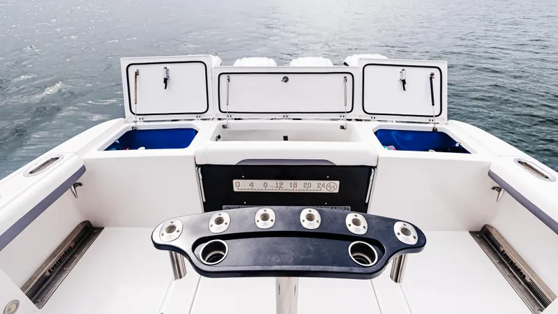 Slide: The Image of 2017 Everglades 435 CC boat deck with fishing rod holders and storage compartments. - 20