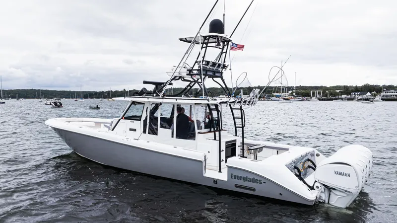 Slide: The Image of 2017 Everglades 435 CC boat on water with Yamaha engines, featuring a sleek design. - 6