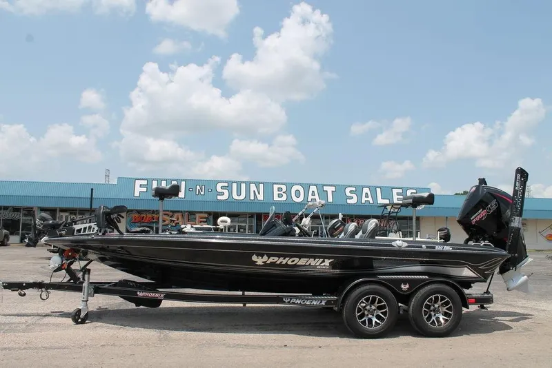 The Image of 2025 Phoenix 920 Elite boat at dealership, clear sky background. - 1