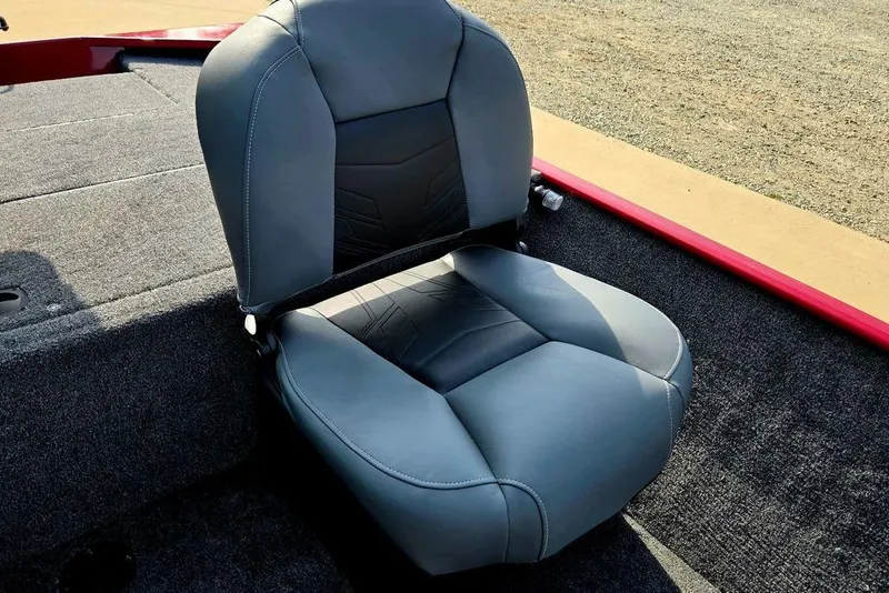 Slide: The Image of 2026 Tracker Bass Tracker Classic XL boat seat with gray upholstery on a carpeted deck. - 9