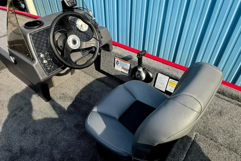 Slide: The Image of Interior of 2026 Tracker Bass Tracker Classic XL boat with steering wheel and seat. - 11