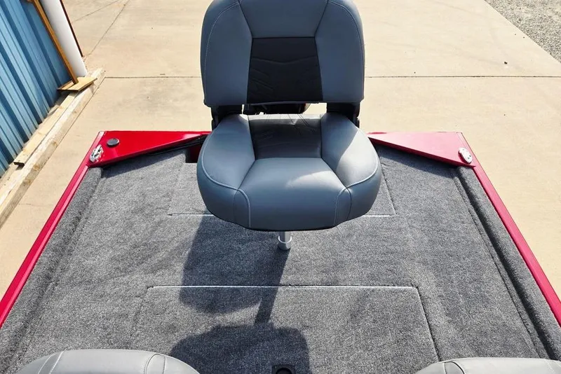 Slide: The Image of 2026 Tracker Bass Tracker Classic XL boat seat on gray carpeted deck. - 13