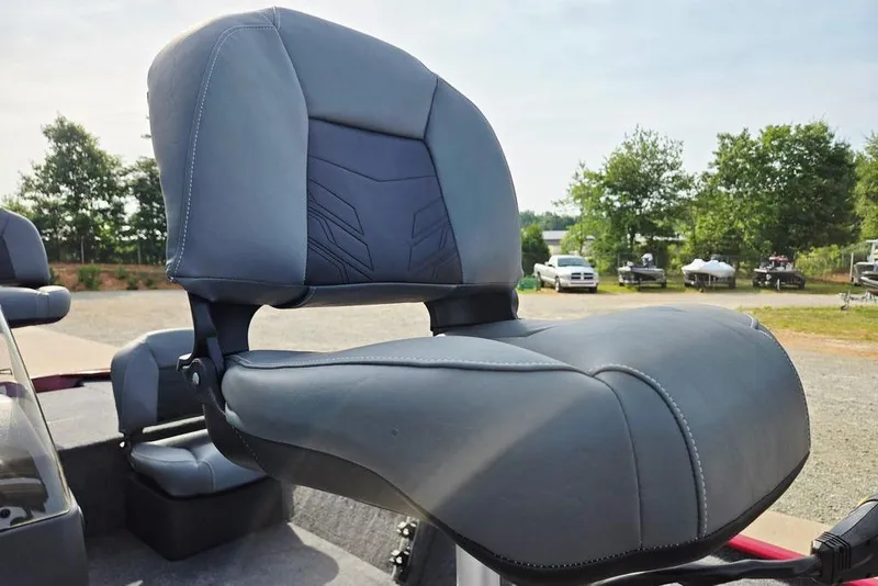 Slide: The Image of 2026 Tracker Bass Tracker Classic XL boat seat, gray upholstery, outdoor setting. - 31
