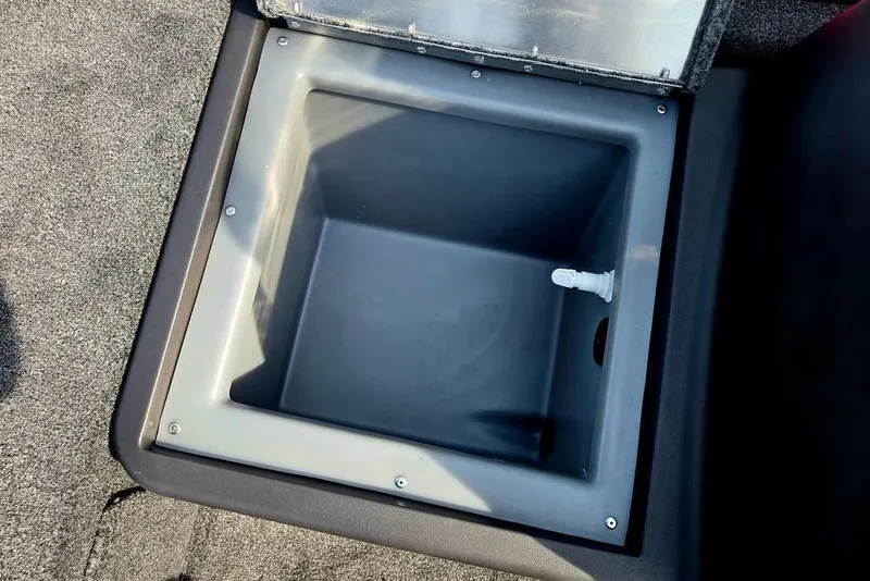 Slide: The Image of Open storage compartment in 2026 Tracker Bass Tracker Classic XL boat. - 23