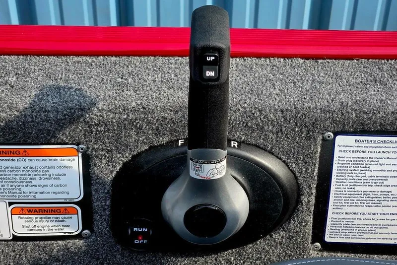 Slide: The Image of 2026 Tracker Bass Tracker Classic XL throttle control with safety warnings and boater's checklist. - 32