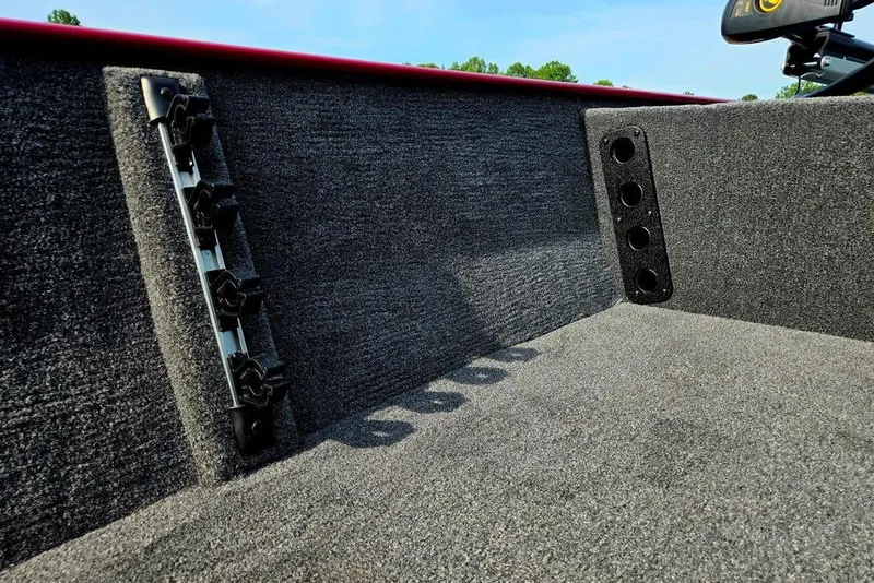 Slide: The Image of Interior of 2026 Tracker Bass Tracker Classic XL boat with rod holders and carpeted finish. - 8