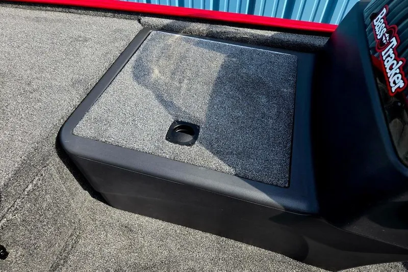 Slide: The Image of 2026 Tracker Bass Tracker Classic XL boat interior with carpeted storage compartment. - 33