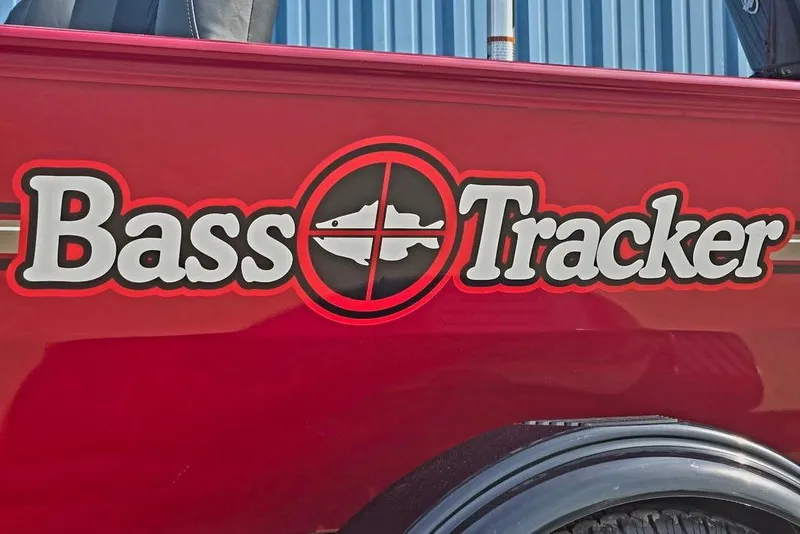 Slide: The Image of Red 2026 Tracker Bass Tracker Classic XL boat with logo and fish graphic. - 21