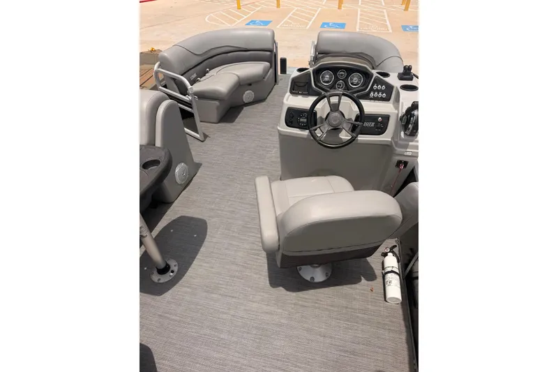 Slide: The Image of Interior of a 2021 Lowe SS 210 boat with steering console and seating. - 10