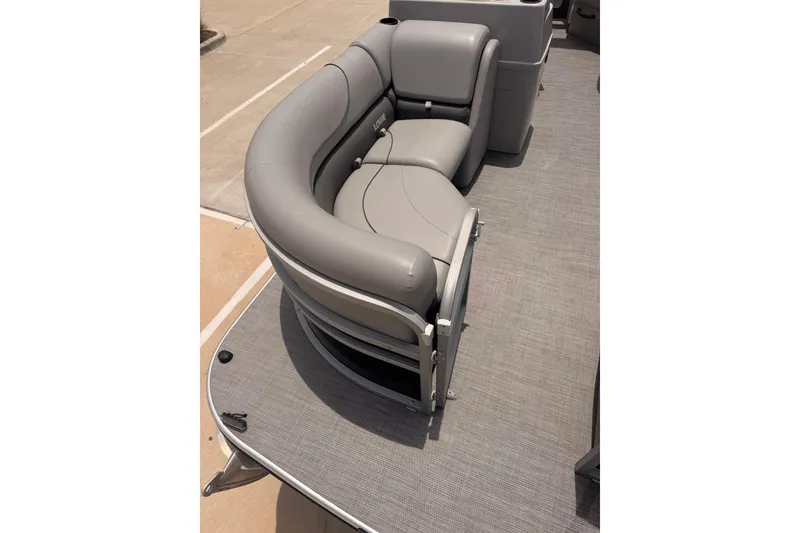 Slide: The Image of Gray seating on a 2021 Lowe SS 210 pontoon boat deck. - 4