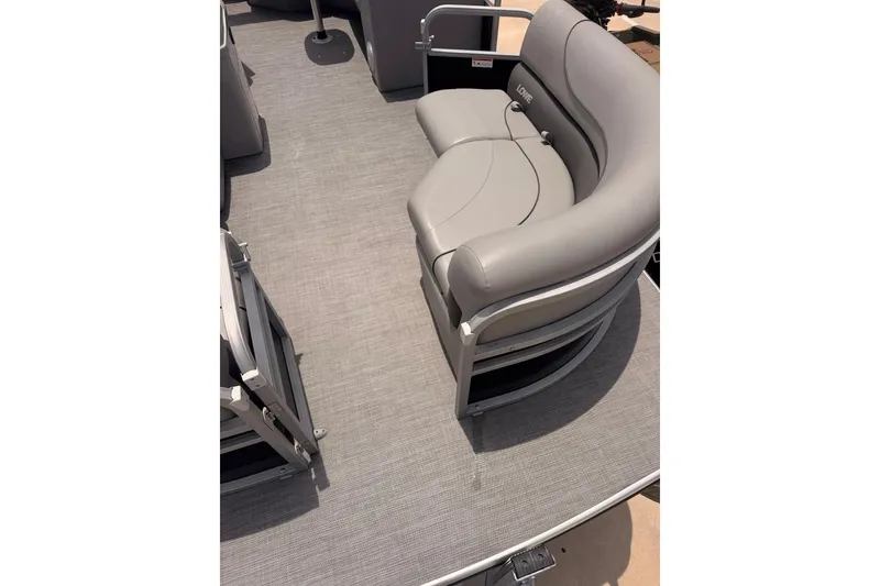 Slide: The Image of 2021 Lowe SS 210 pontoon boat with gray seating and flooring. - 5