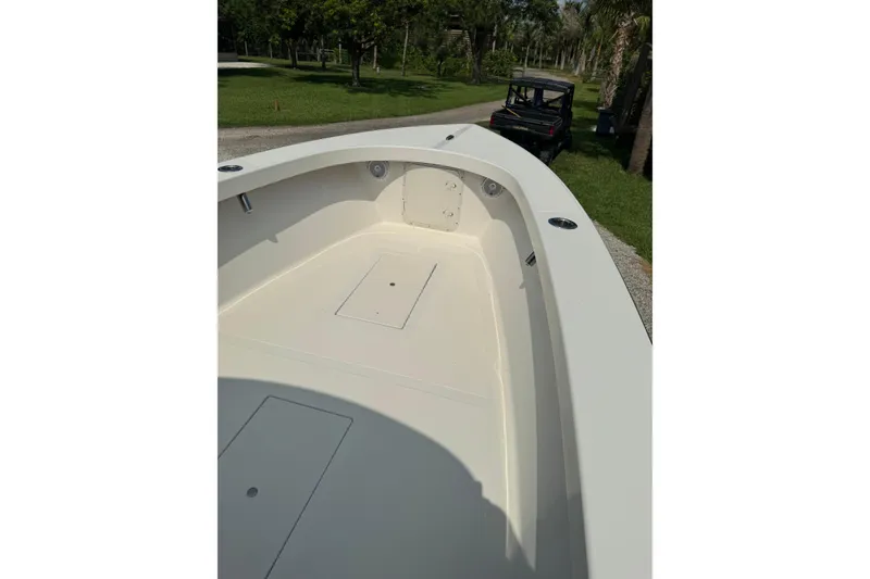 Slide: The Image of 2022 Rambo 27 boat interior, featuring spacious deck and storage compartments. - 8