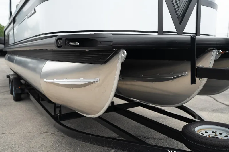 Slide: The Image of 2026 Viaggio Diamante U 26 pontoon boat on trailer, showcasing sleek aluminum pontoons. - 11
