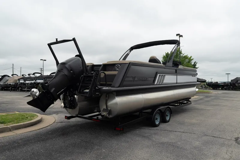 Slide: The Image of 2026 Viaggio Diamante U 26 pontoon boat on trailer, parked outdoors. - 3