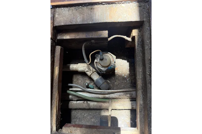 Slide: The Image of 1977 Morgan Out Island 51 boat engine compartment with visible wiring and components. - 54