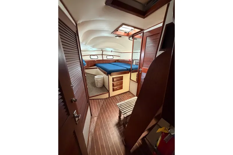 Slide: The Image of Interior of a 1977 Morgan Out Island 51 sailboat with wooden finishes and cozy cabin. - 32