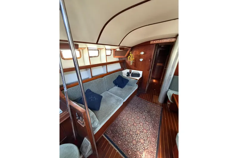 Slide: The Image of Interior of 1977 Morgan Out Island 51 yacht with cozy seating and nautical decor. - 42
