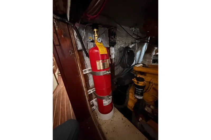 Slide: The Image of Fire extinguisher in the engine room of a 1977 Morgan Out Island 51 sailboat. - 37
