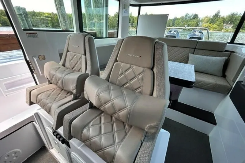 Slide: The Image of Interior of 2024 Axopar 37 XC Cross Cabin with luxurious seating and panoramic windows. - 16