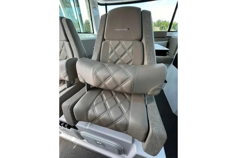 Slide: The Image of Luxurious seating in the 2024 Axopar 37 XC Cross Cabin with quilted leather design. - 15