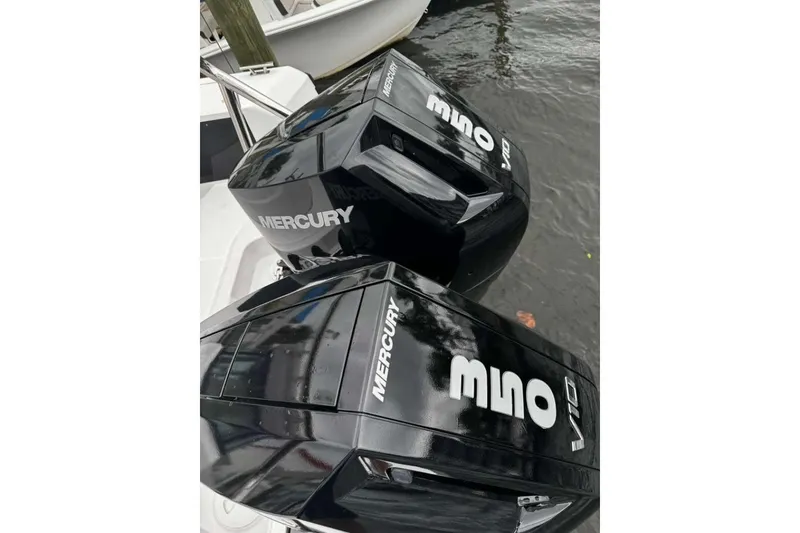 Slide: The Image of Twin Mercury outboard engines on 2024 Axopar 37 XC Cross Cabin boat. - 11
