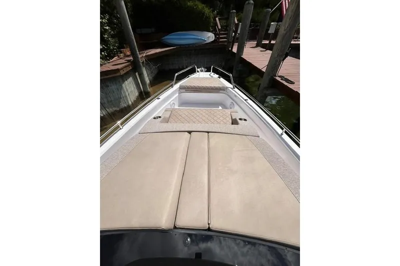 Slide: The Image of 2024 Axopar 37 XC Cross Cabin boat with spacious sunbathing area and sleek design. - 20
