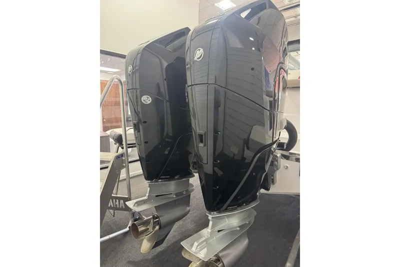 Slide: The Image of Twin outboard engines on a 2024 Axopar 37 XC Cross Cabin boat. - 9