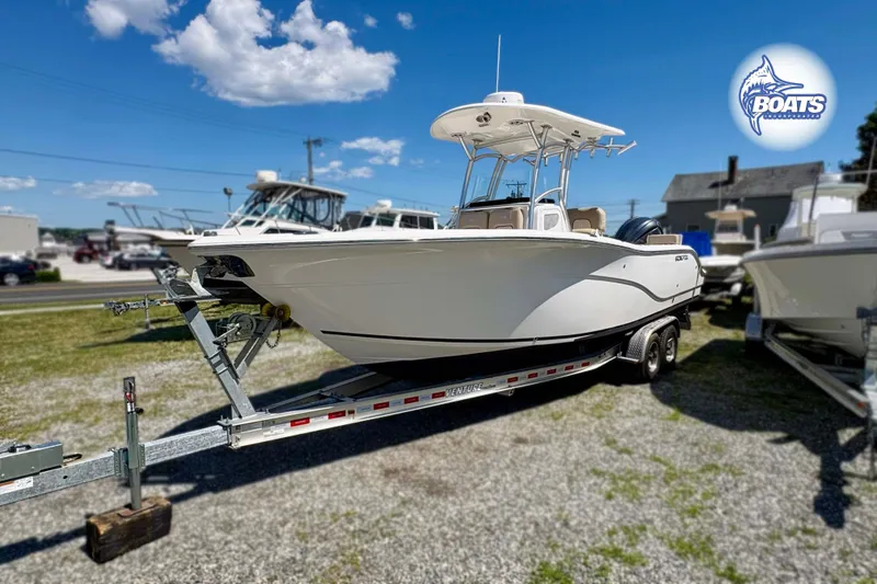 The Image of 2015 Sea Fox 266 Commander boat on trailer under clear blue sky. - 0