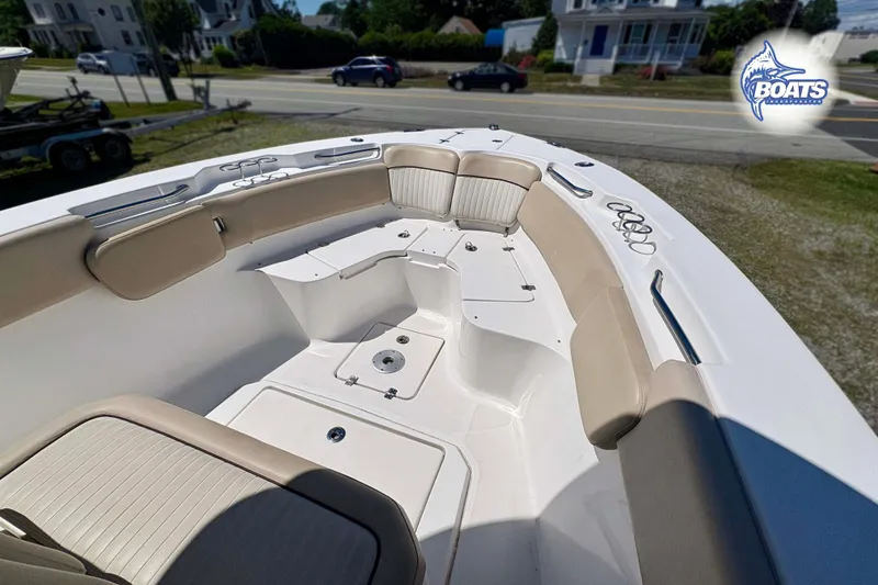 Slide: The Image of 2015 Sea Fox 266 Commander boat interior with cushioned seating and storage compartments. - 2