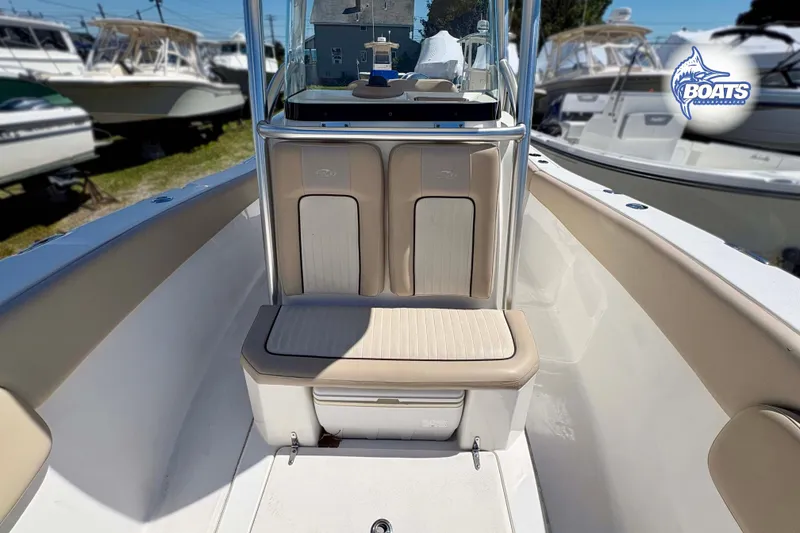 Slide: The Image of 2015 Sea Fox 266 Commander boat interior with cushioned seating and console. - 4