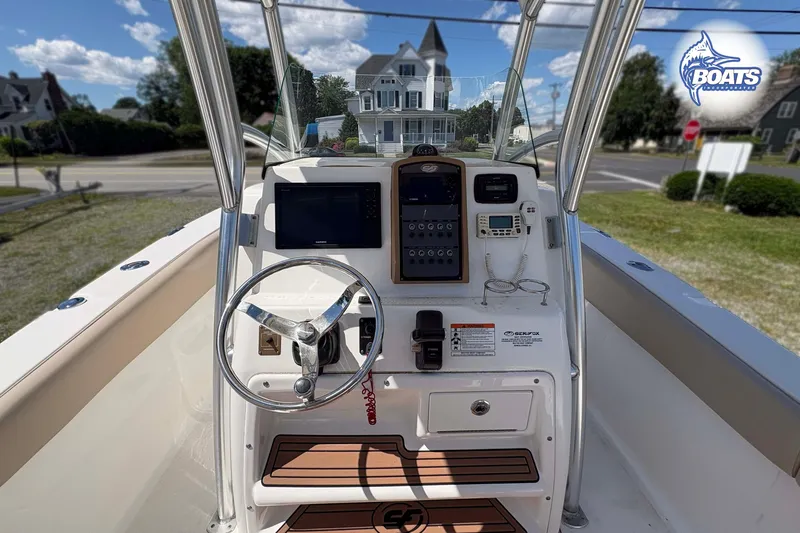 Slide: The Image of 2015 Sea Fox 266 Commander boat console with steering wheel and navigation equipment. - 6