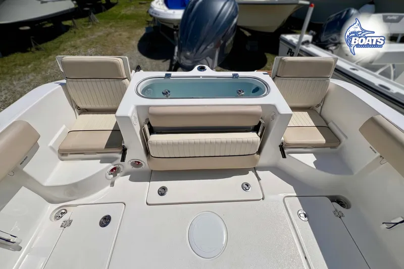 Slide: The Image of 2015 Sea Fox 266 Commander boat interior with seating and storage compartments. - 8