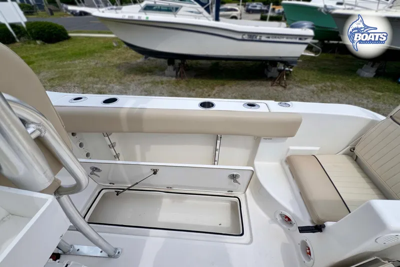 Slide: The Image of 2015 Sea Fox 266 Commander boat interior with seating and storage compartments. - 9