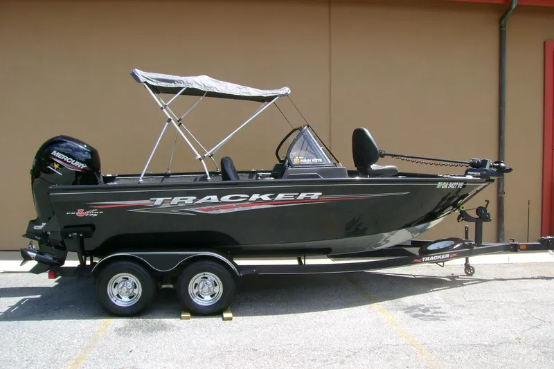 The Image of 2023 Tracker Pro Guide V-175 WT boat on trailer, featuring a Mercury engine. - 1