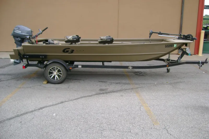 The Image of 2023 G3 1652 DK boat on trailer, parked in a lot. - 1