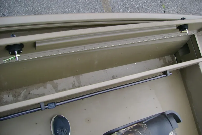 Slide: The Image of Interior view of 2023 G3 1652 DK boat showing storage compartment and seat. - 11