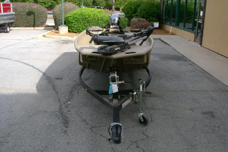 Slide: The Image of 2023 G3 1652 DK boat on trailer in parking lot, front view. - 13