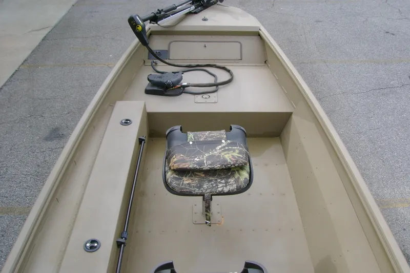 Slide: The Image of 2023 G3 1652 DK boat interior with camo seat and trolling motor. - 6