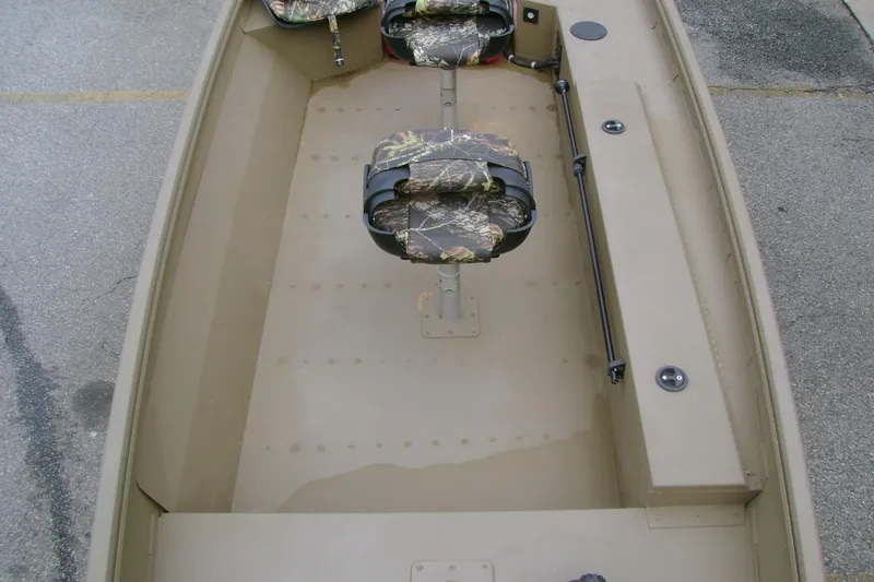 Slide: The Image of 2023 G3 1652 DK boat interior with camouflage seats and spacious layout. - 9