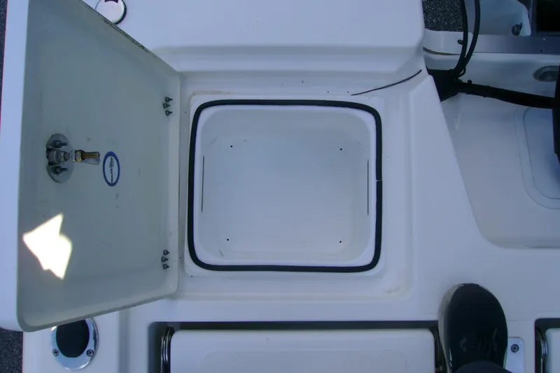Slide: The Image of Open storage compartment on 2022 NauticStar 227 XTS boat deck. - 11