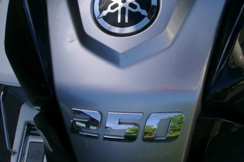 Slide: The Image of Close-up of a 2022 NauticStar 227 XTS boat engine with "250" emblem. - 13