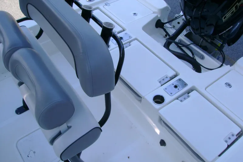 Slide: The Image of 2022 NauticStar 227 XTS boat interior with seating and storage compartments. - 15
